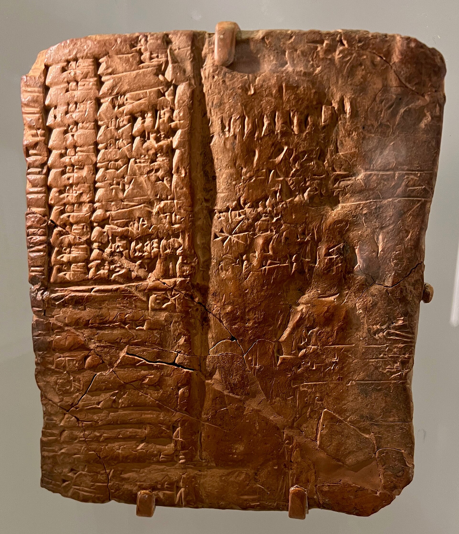 A small clay tablet covered in columns of cuneiform signs.