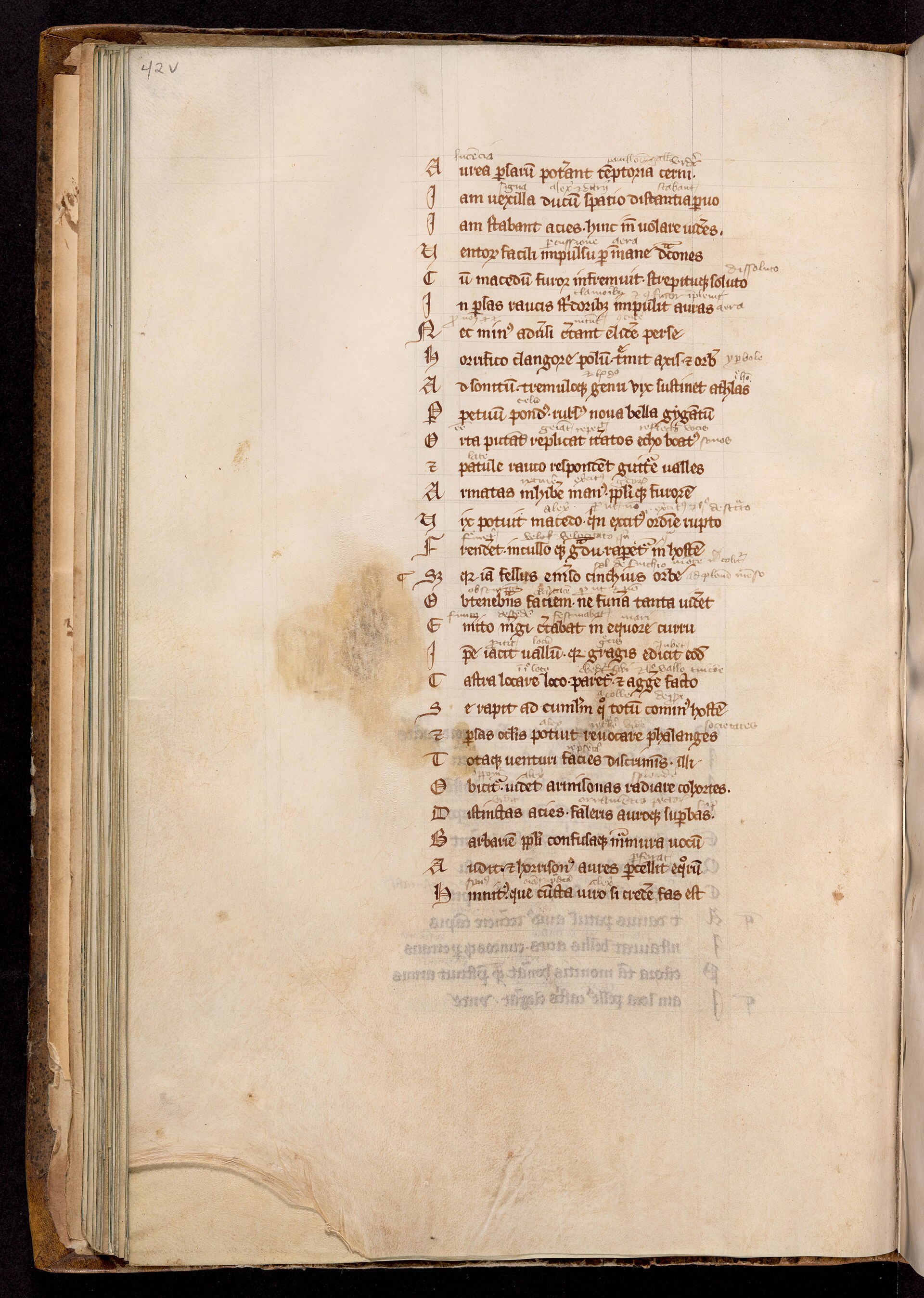 A medieval manuscript page whose central text is surrounded by dense handwritten commentary.