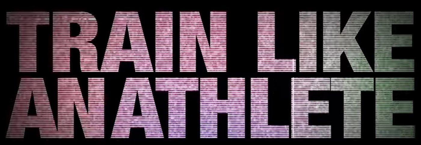A frame from the video: the words “TRAIN LIKE AN ATHLETE” in large capitals glowing on a black background, with a horizontal scanline effect shading from pink to green